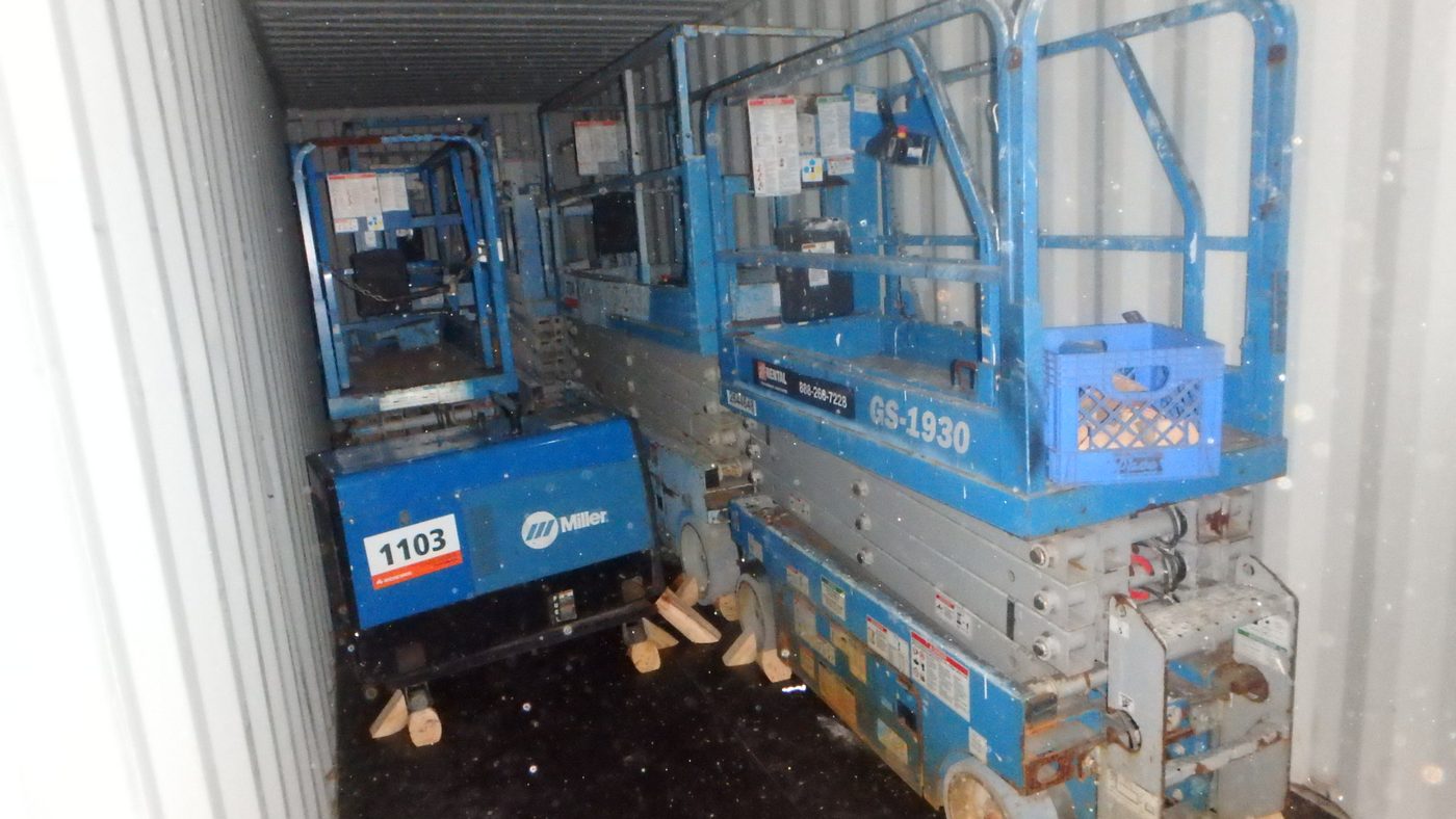 Scissor lifts and welder loaded into a container for shipment